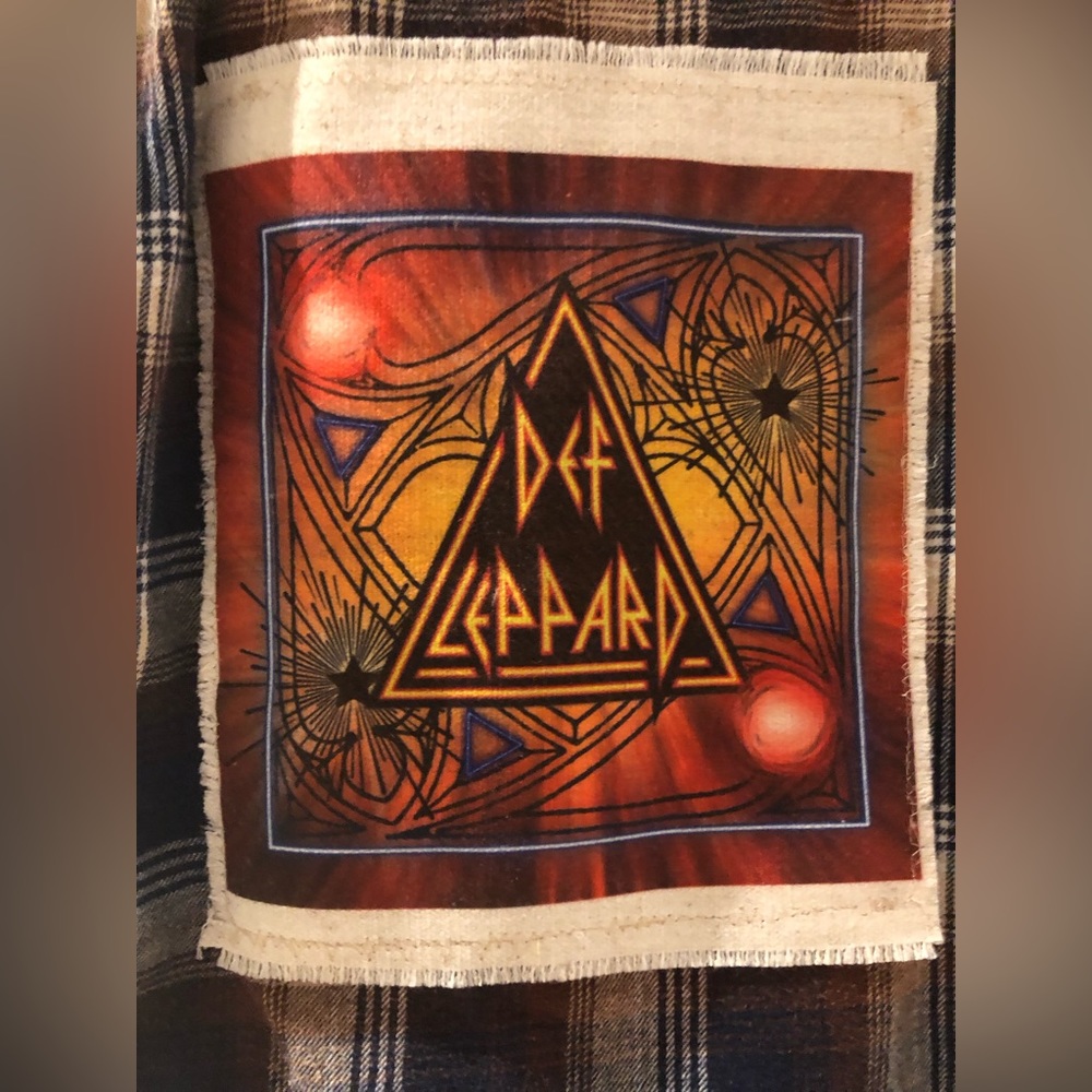 Vintage re worked plaid flannel shirt with Def Leppard fabric appliqué